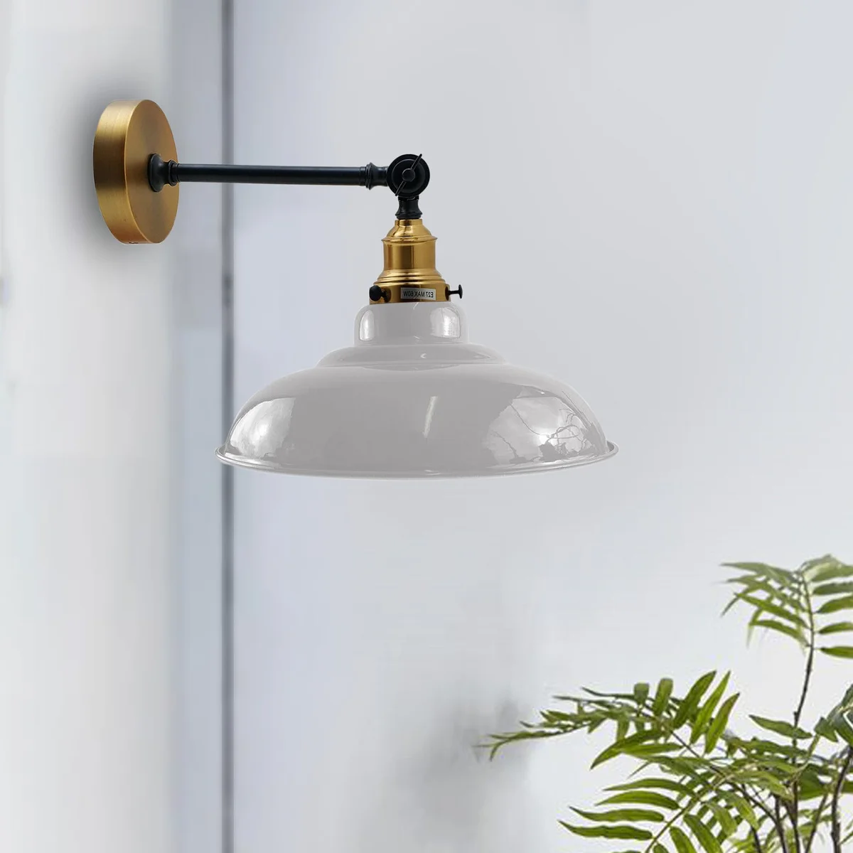 White metal adjustable wall lamp with curved shade, mounted on a wall, showcasing a modern loft style fixture.