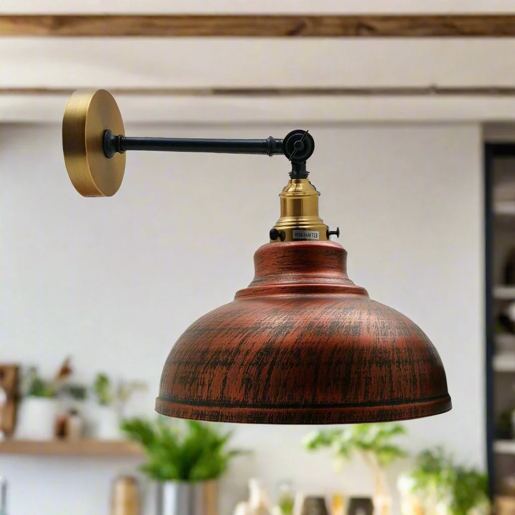 Rustic red metal wall lamp with a curvy dome shade, mounted on wall and adjustable arm.