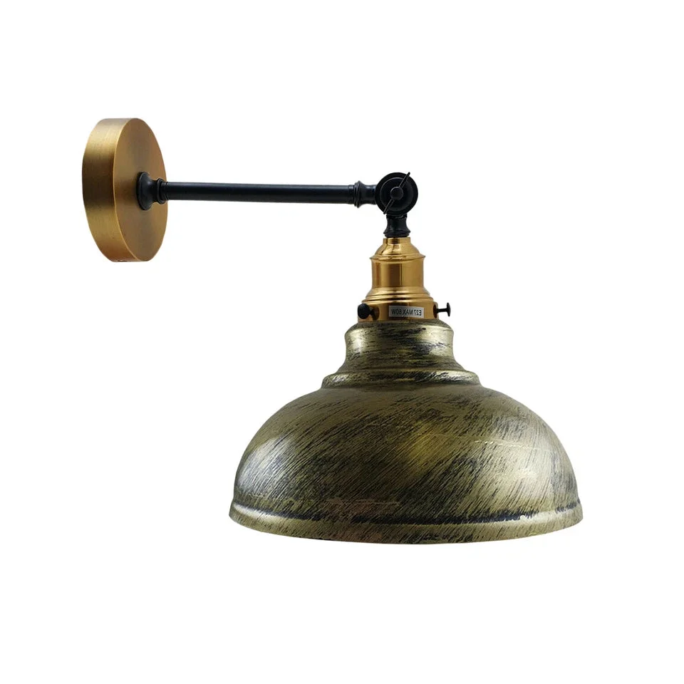 Adjustable wall light in brushed brass with a curved dome shade and adjustable arm, ideal for industrial decor