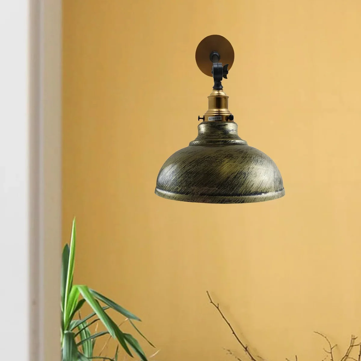Brushed brass vintage dome wall light with adjustable arm and 29 cm curved metal shade.
