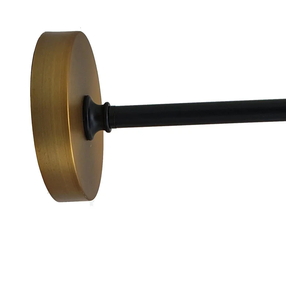 Brushed brass adjustable wall light with thickened metal body, curvy 29cm dome shade, and flexible arm for directing light