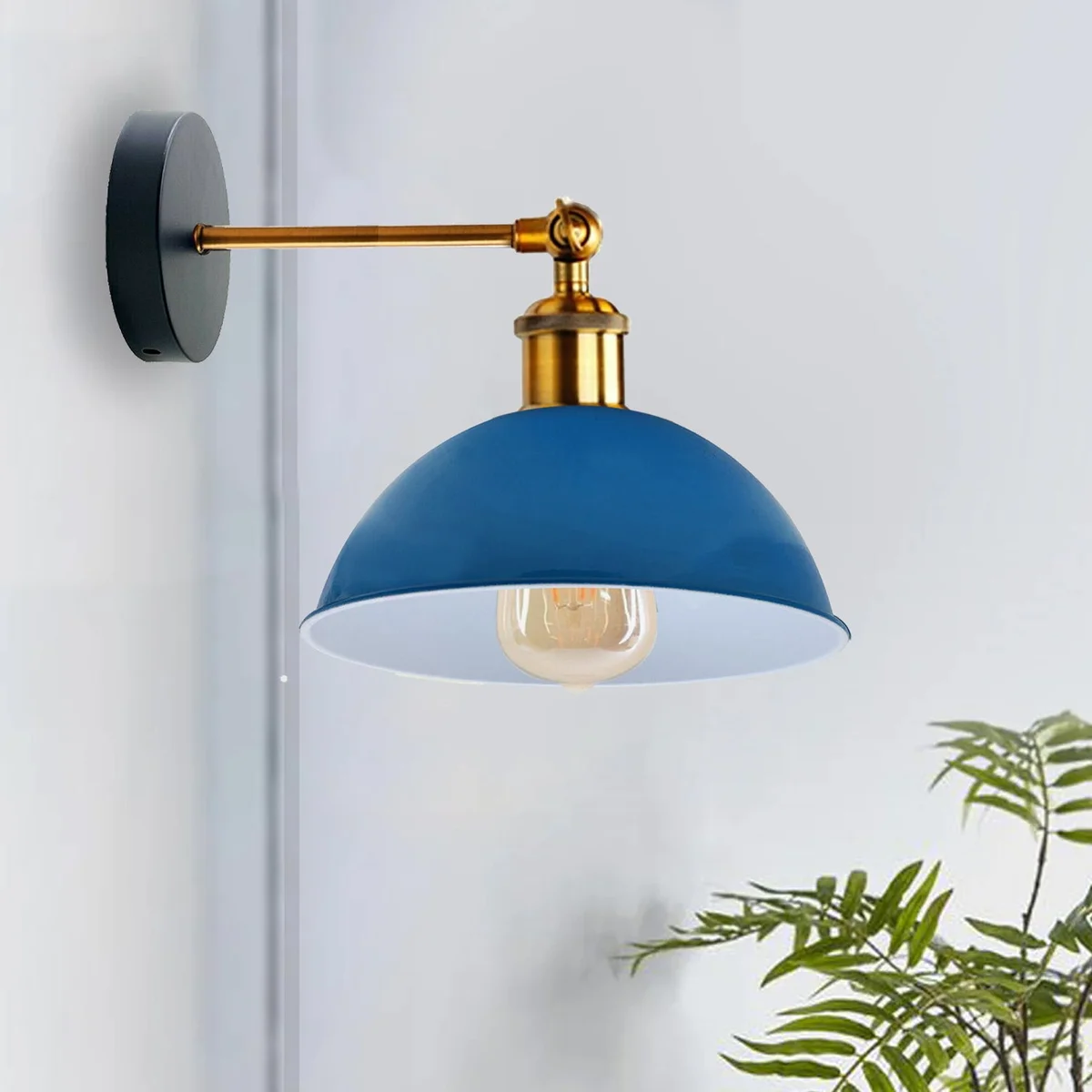 Modern indoor wall lights featuring a sleek black metal dome shade on a wall sconce with mounting arm