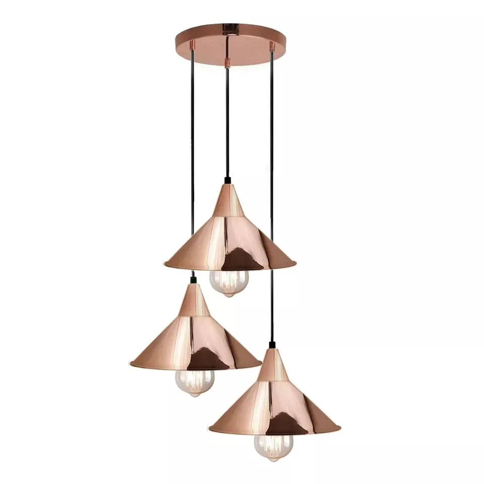 Modern industrial pendant light with rose gold metal shade and 3 E27 lamp holders, hanging from ceiling with PVC cable.
