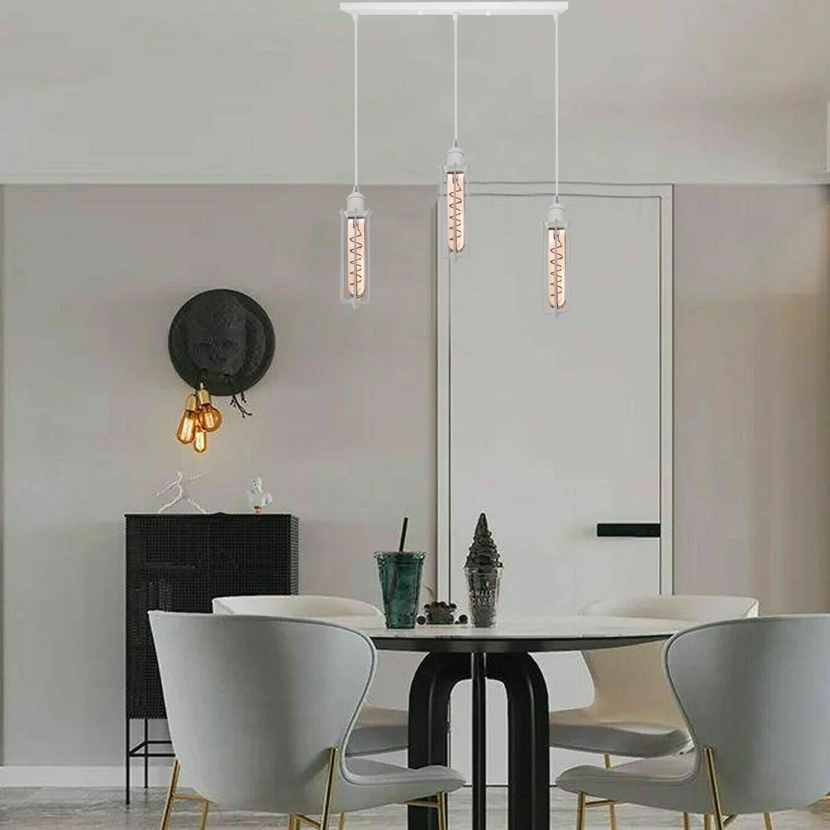 White pendant lamp with three shiny metal and PVC wire cage shades, industrial retro loft style