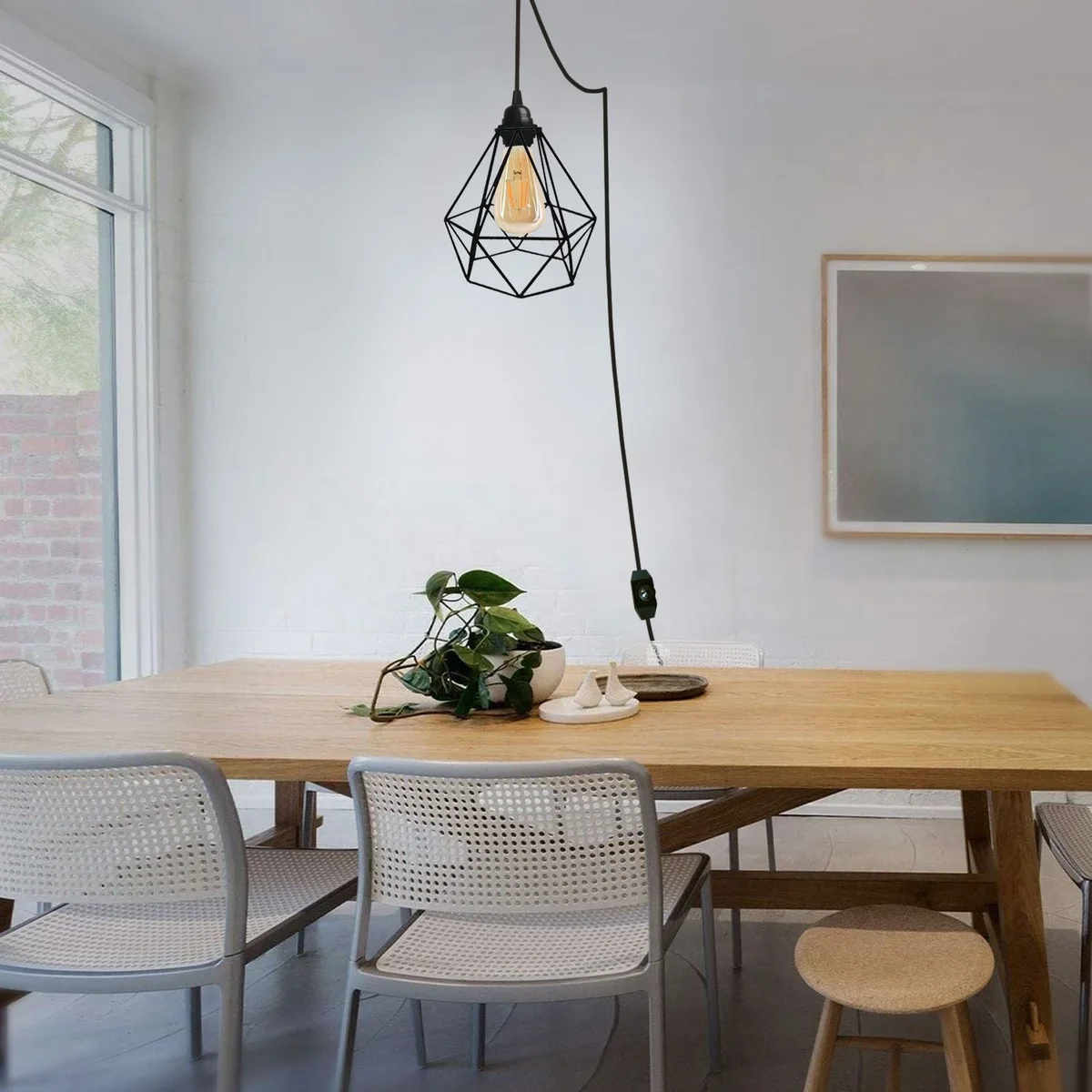 Black plug in pendant light with fabric cable, dimmer switch, metal cage and E27 holder.
