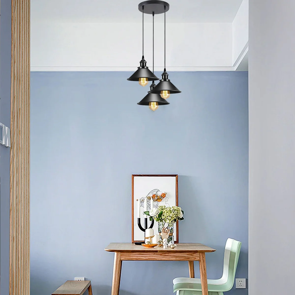 Black metal pendant light with cone shade, metal frame, PVC cable, E27 base, hanging from ceiling.