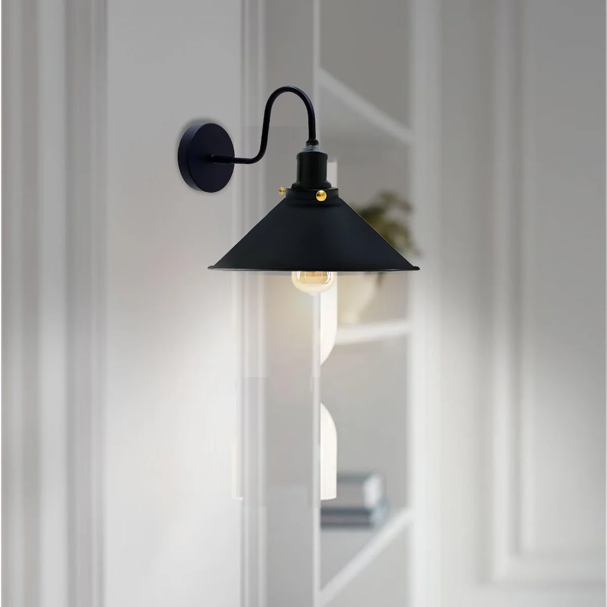 Vintage industrial style lighting swan neck wall sconce with metal cone shade, black finish, mounted on wall