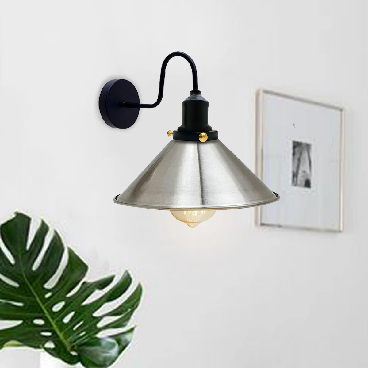 Vintage industrial wall light featuring a swan‑neck arm and a thickened electro‑plated metal shade for a classic E27 fitting.