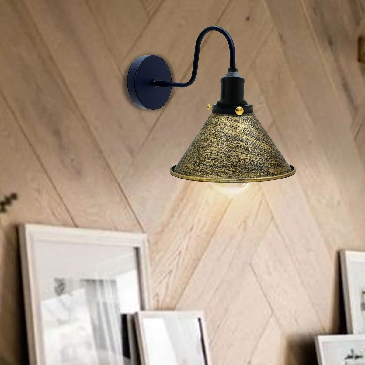 Industrial wall light with cone‑shaped metal shade, sleek design mounted on wall, black finish.