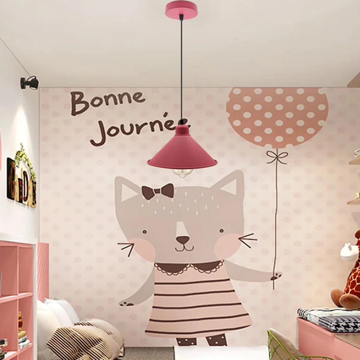 Pink metal pendant light with retro silhouette hanging from a ceiling, showing its soft pastel finish.