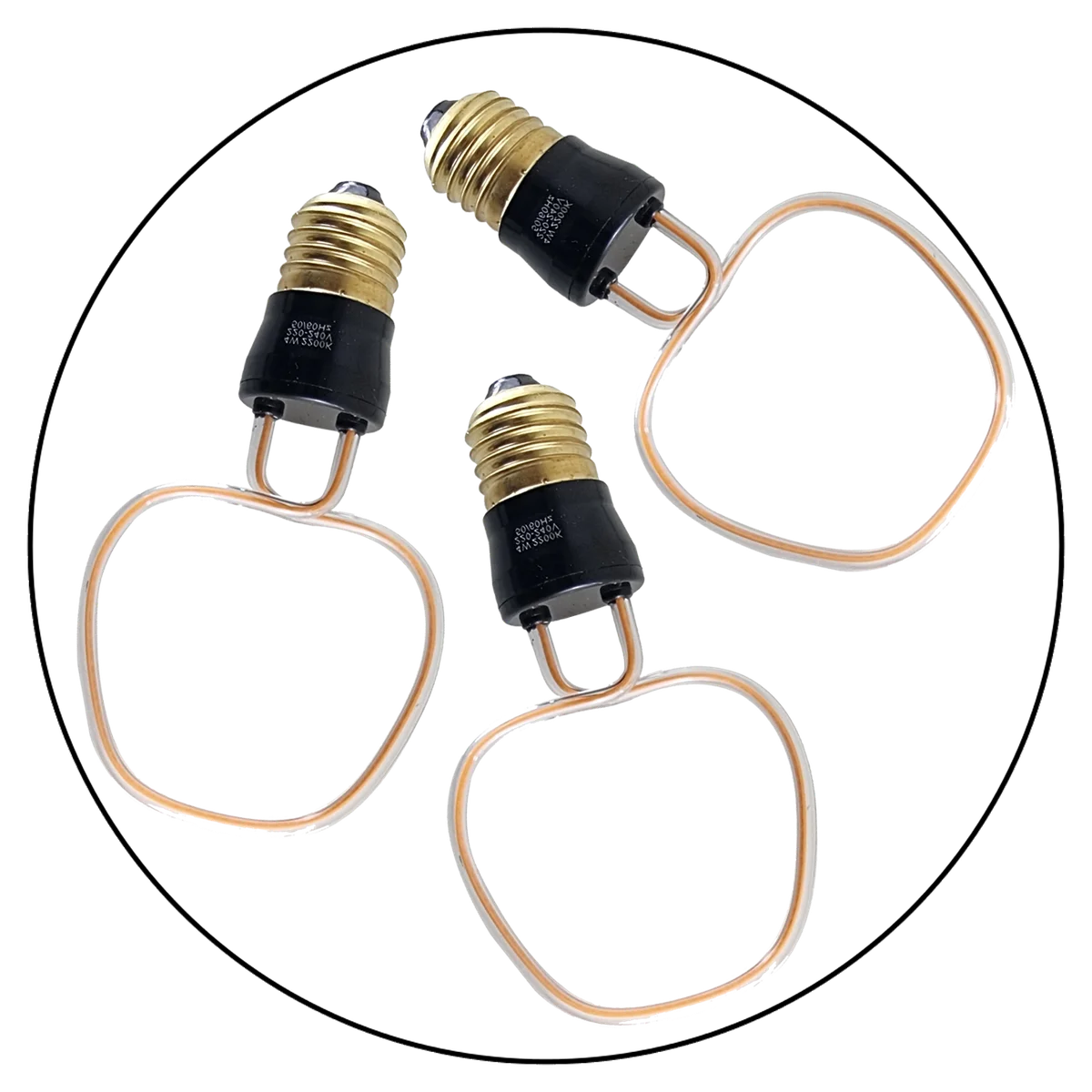 Three warm‑yellow 4 W industrial style bulbs in glass with copper caps, displayed in a product box