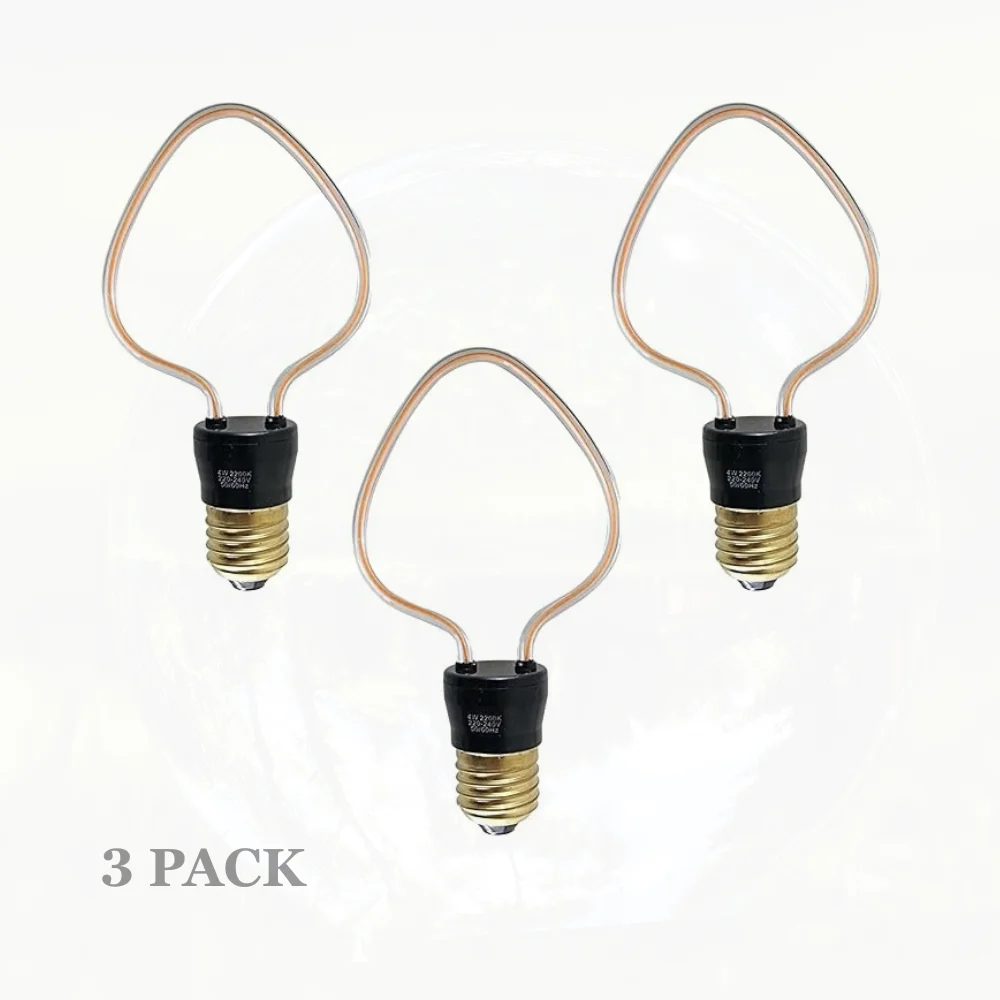3 retro LED bulbs with curvy filaments, warm yellow glow, glass and pure copper body, Edison screw fit.