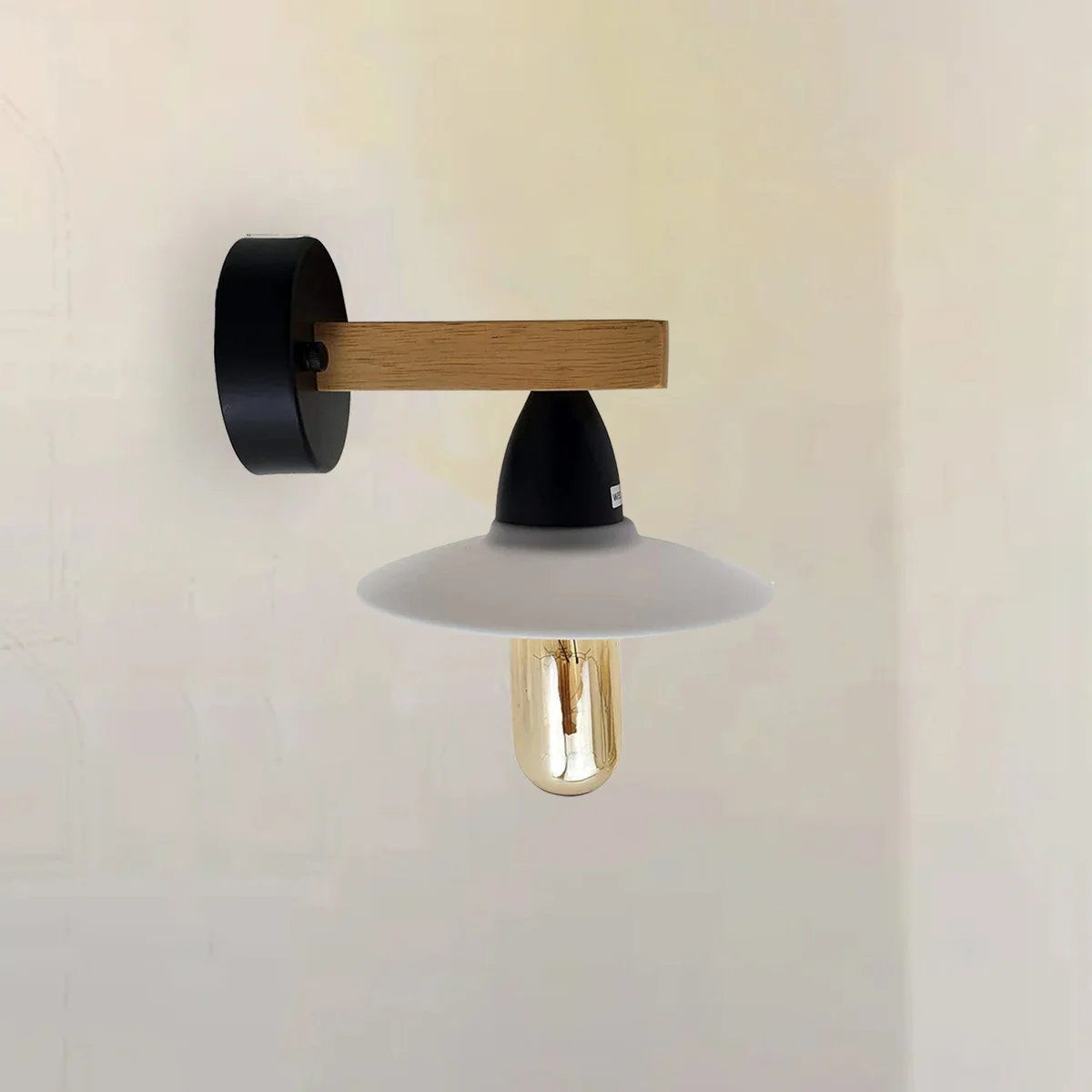 Two vintage modern metal wall lamps with PVC shades and exposed hardware, delivering soft lighting ambience in a bedroom setting.