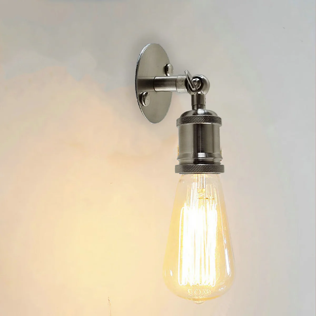 Vintage indoor wall lights: satin nickel wall sconce with galvanized metal base, 8.5cm diameter, retro design on wall.