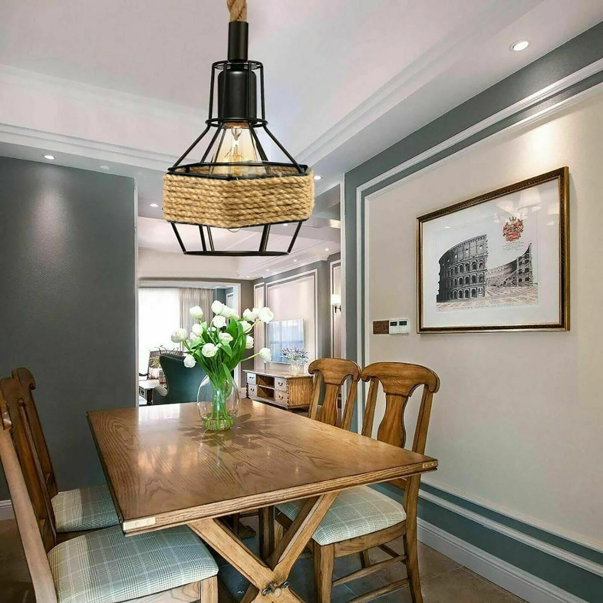 Black metal vintage ceiling light hanging from a 1‑m hemp rope, featuring a 10 cm round metal cage and lamp base.