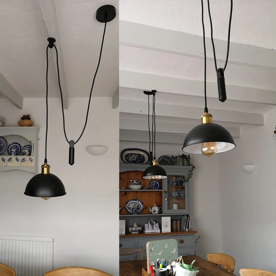 Black industrial pendant light with metal frame, 21 cm shade, E27 holder, hanging by 195 cm cable from ceiling.