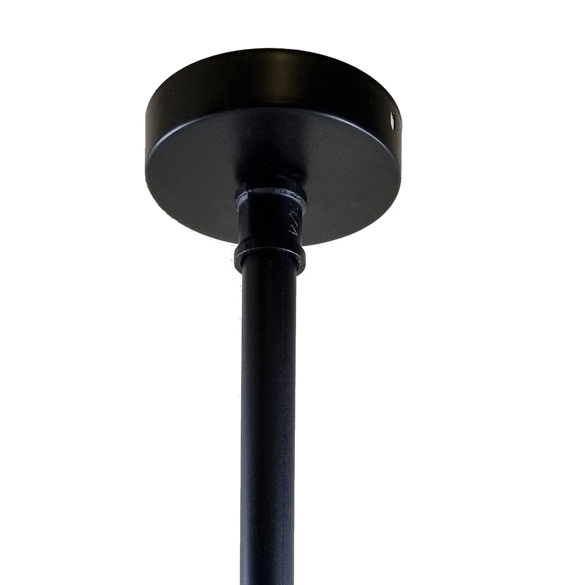Black iron lampshade hanging from ceiling, matte black finish with subtle rust highlights, vintage industrial style.