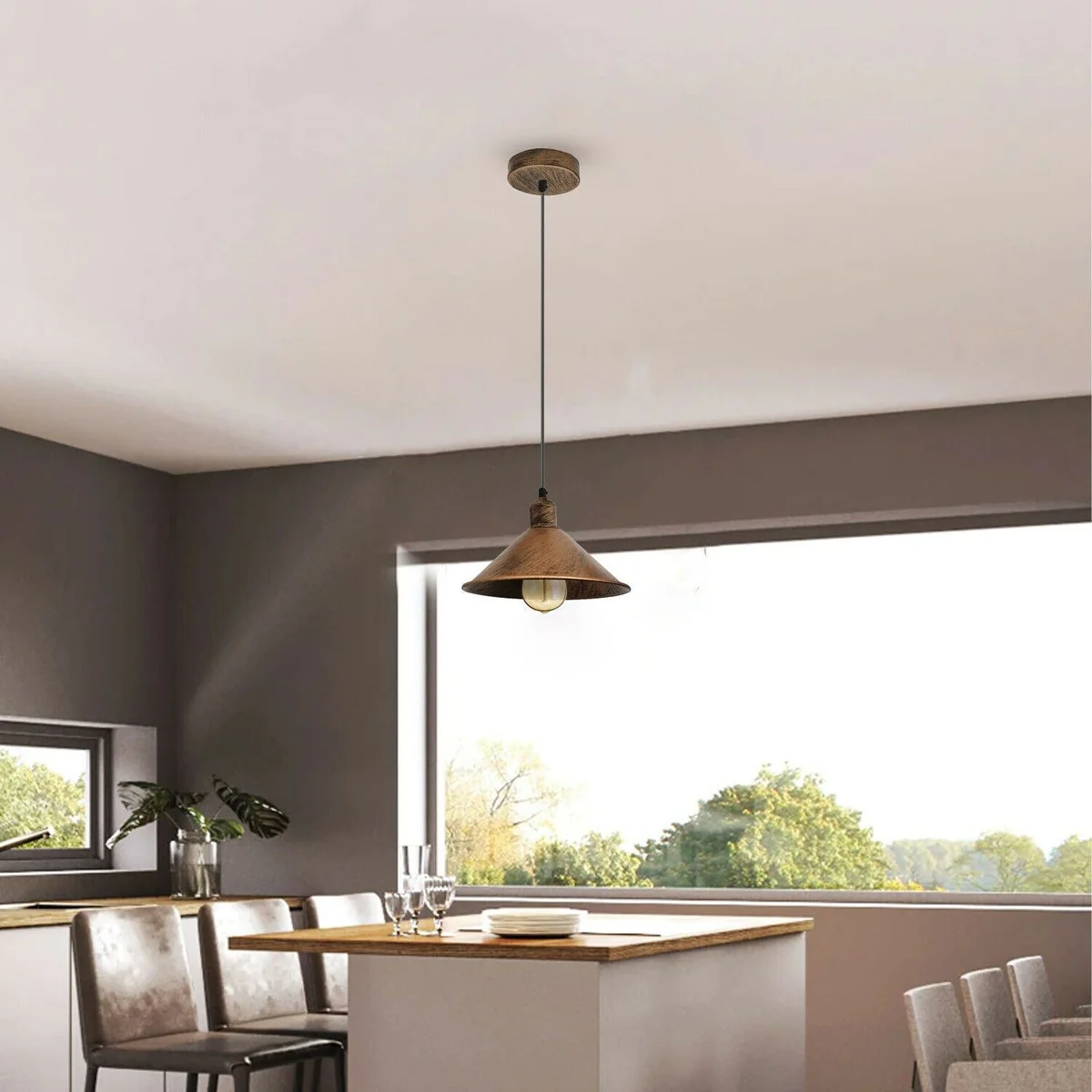 Brushed metal pendant light with metal shade and PVC cable, hanging from ceiling in modern style.