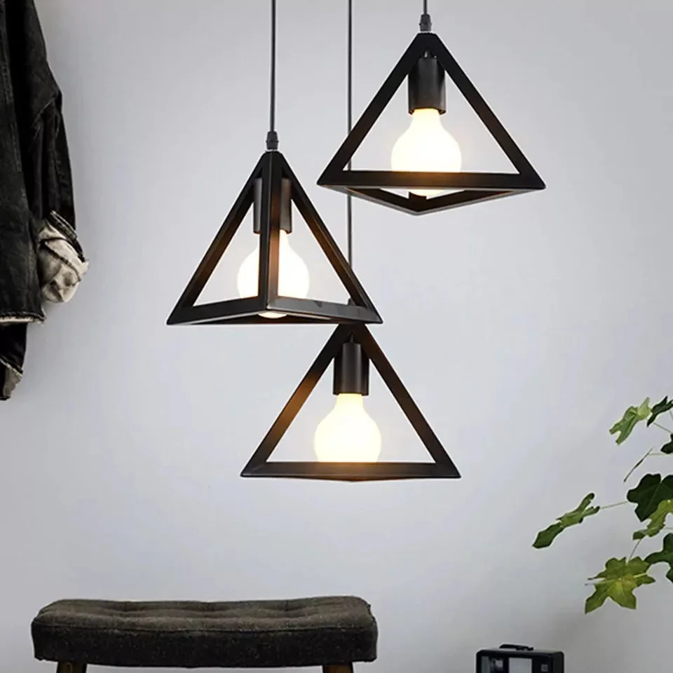 Black wire-framed triangular lamp hanging from ceiling, featuring a vintage style light with an E27 holder