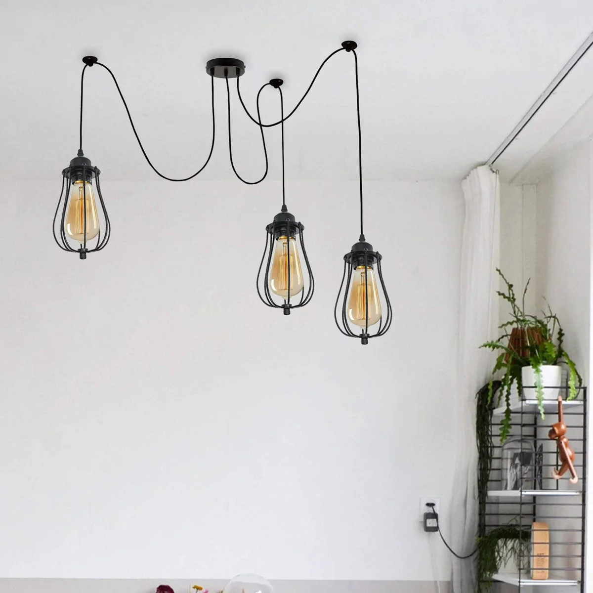 Matt black industrial pendant light with spider‑style wire cage shadows 2m PVC fabric cables.