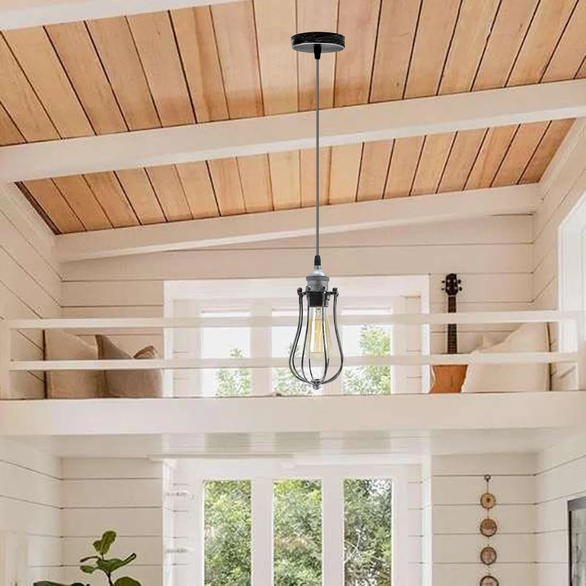E27 pendant light cage with chrome metal frame, PVC cable 95cm, hanging over a kitchen table.