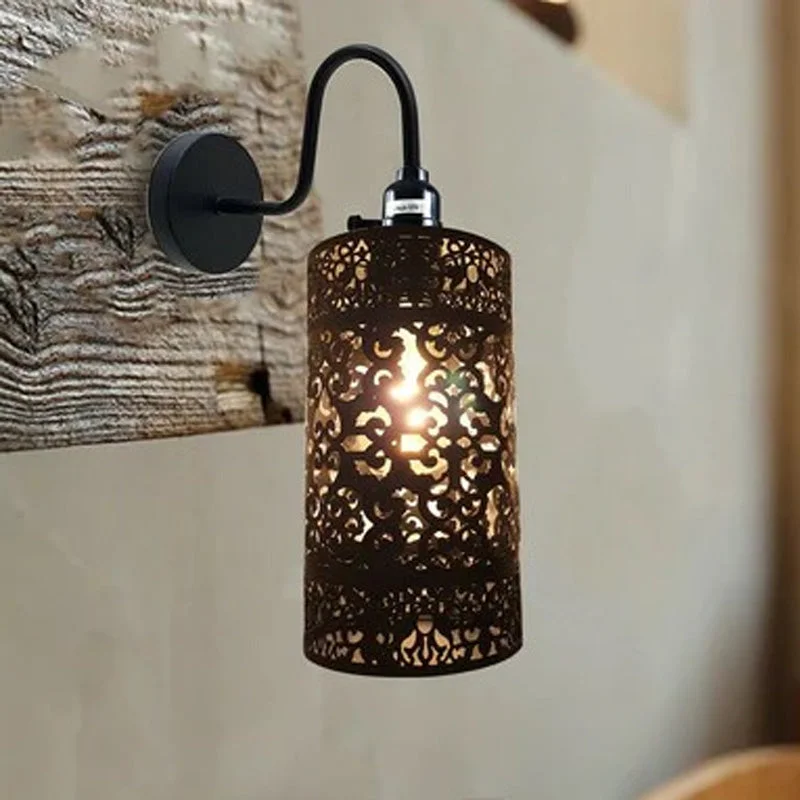 Black metal industrial wall light with adjustable swan neck arm and drum‑shaped shade