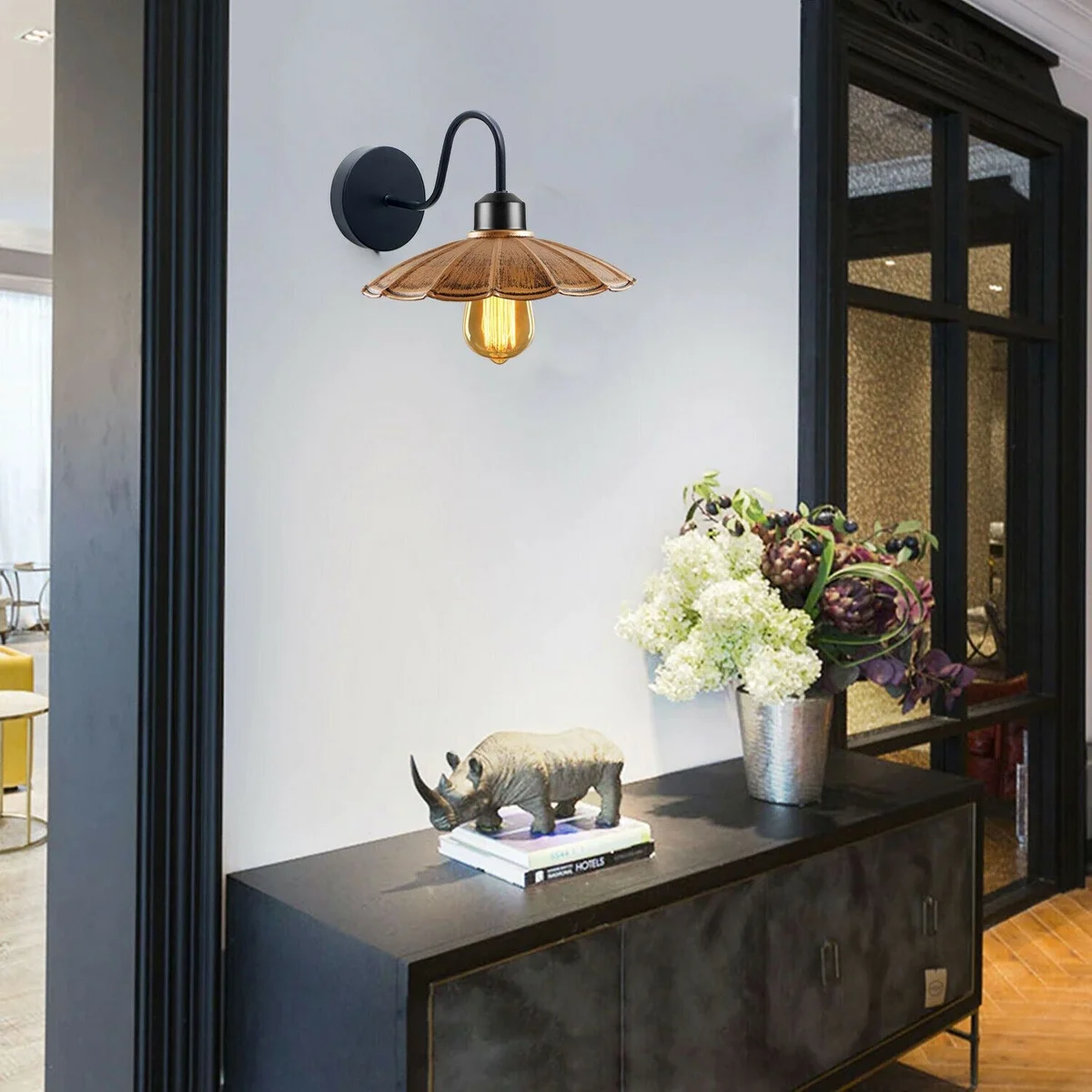 Black brushed metal swan wall lamp with umbrella-shaped shade mounted on a wall