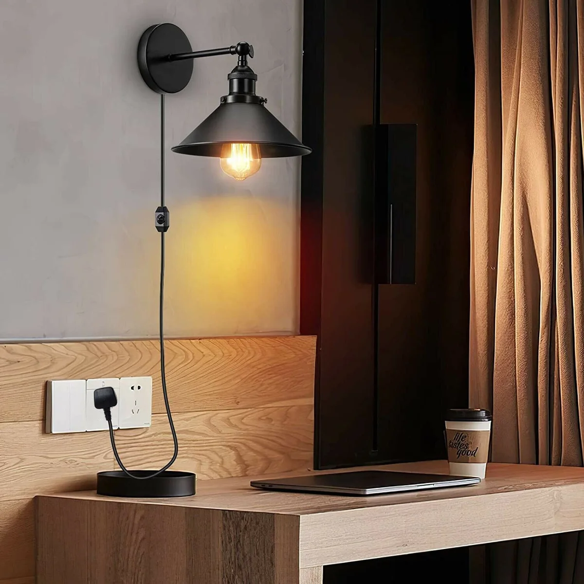 Black metal wall light with conical shade, metal and PVC plug‑in arm, E27 holder, 2m PVC cable and UK plug.