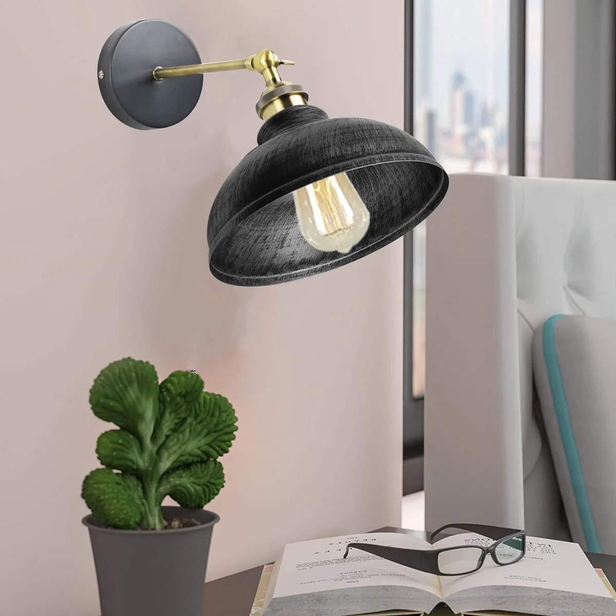 Industrial style lighting with a curvy dome metal shade and adjustable arm, white finish.