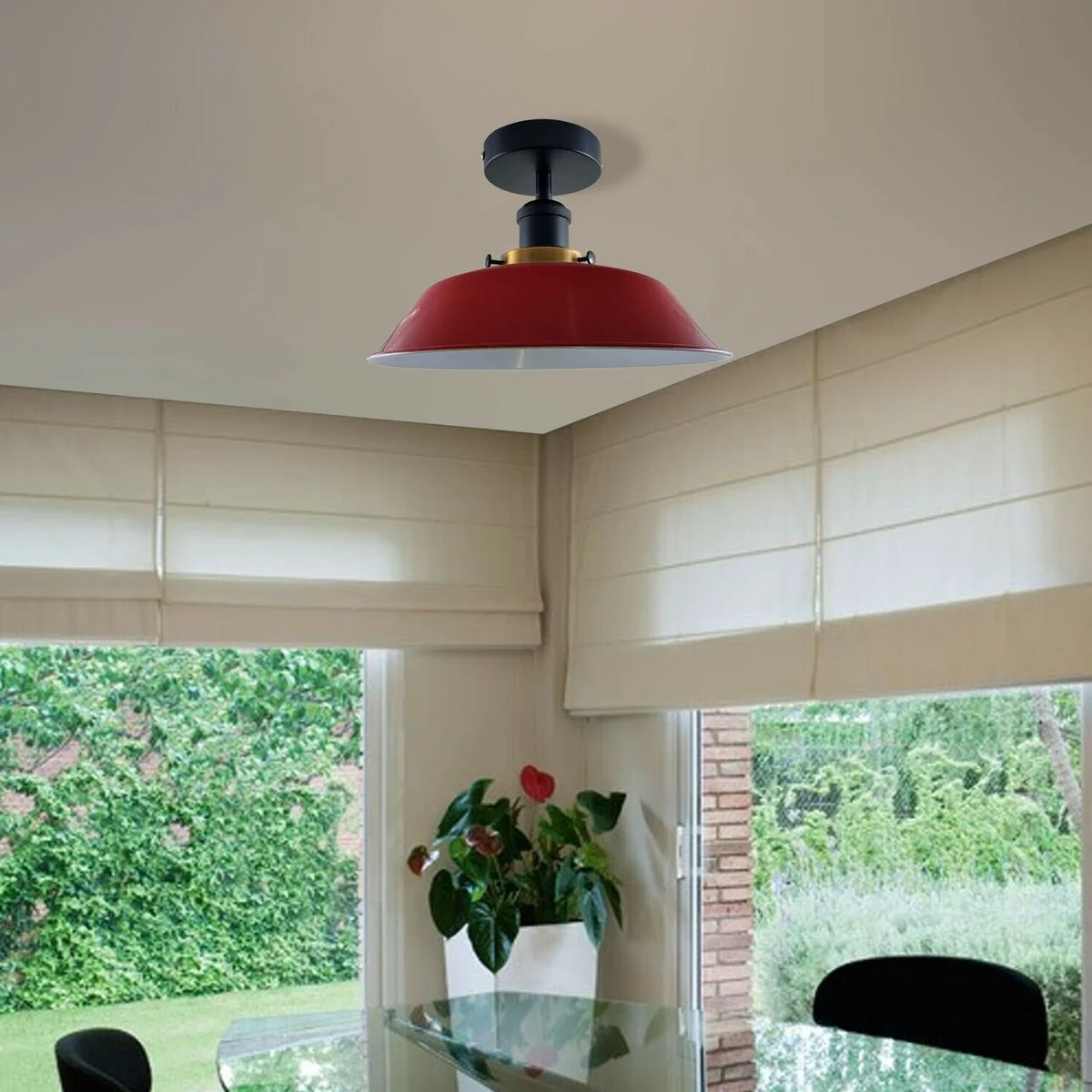 Round vintage style industrial ceiling light with metal shade in blue and black mounting hardware.