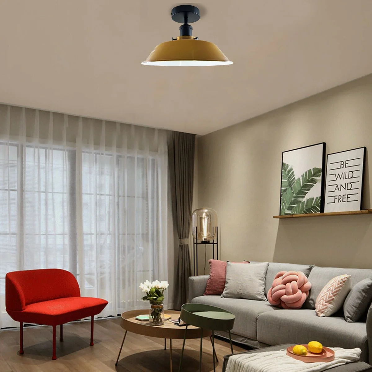 Metal indoor ceiling fixture with semi flush mount, round blue metal shade and black hardware.