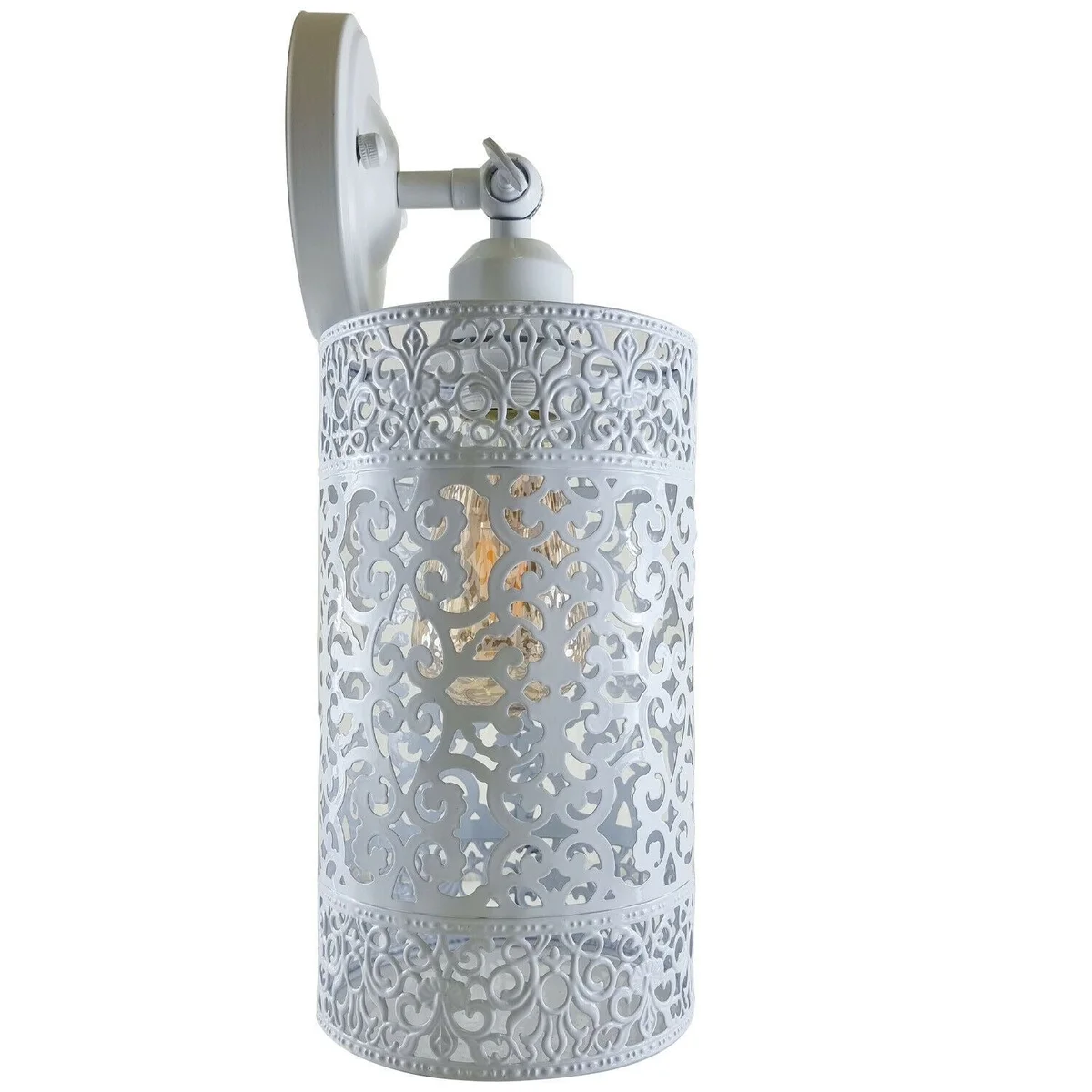 White vintage wall sconce on a wooden wall with a round metal shade and adjustable arm