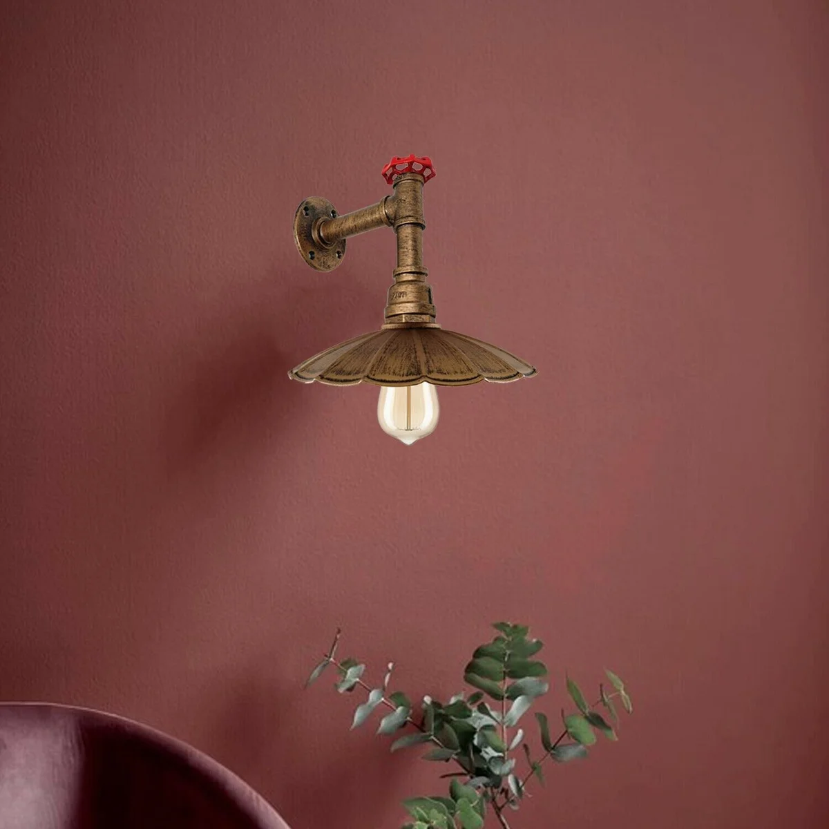 Retro metal pipe with umbrella shade: a vintage industrial wall sconce mounted on a wall.