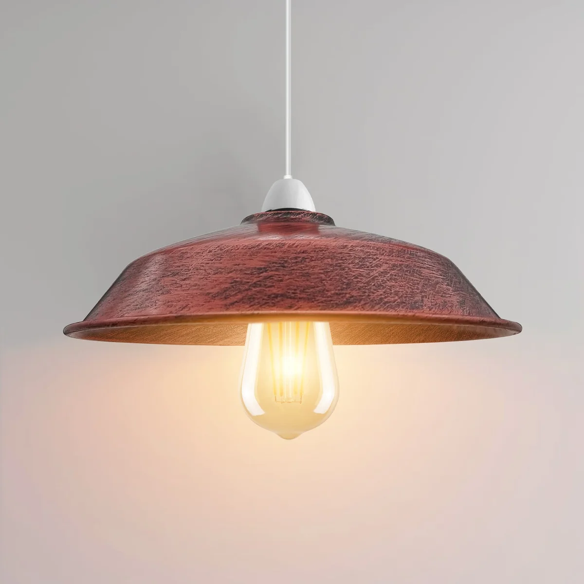 Modern ceiling light shades hanging from ceiling in brushed copper finish, sleek metal design.