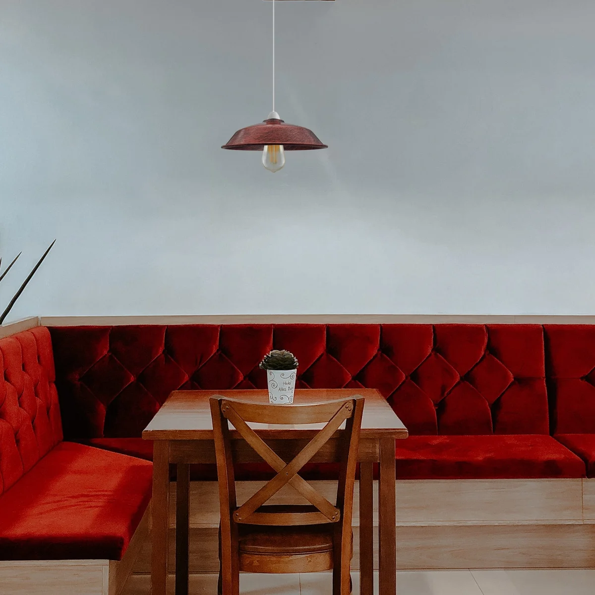 Brushed copper metal contemporary pendant light shade with concrete‑effect finish hanging from ceiling