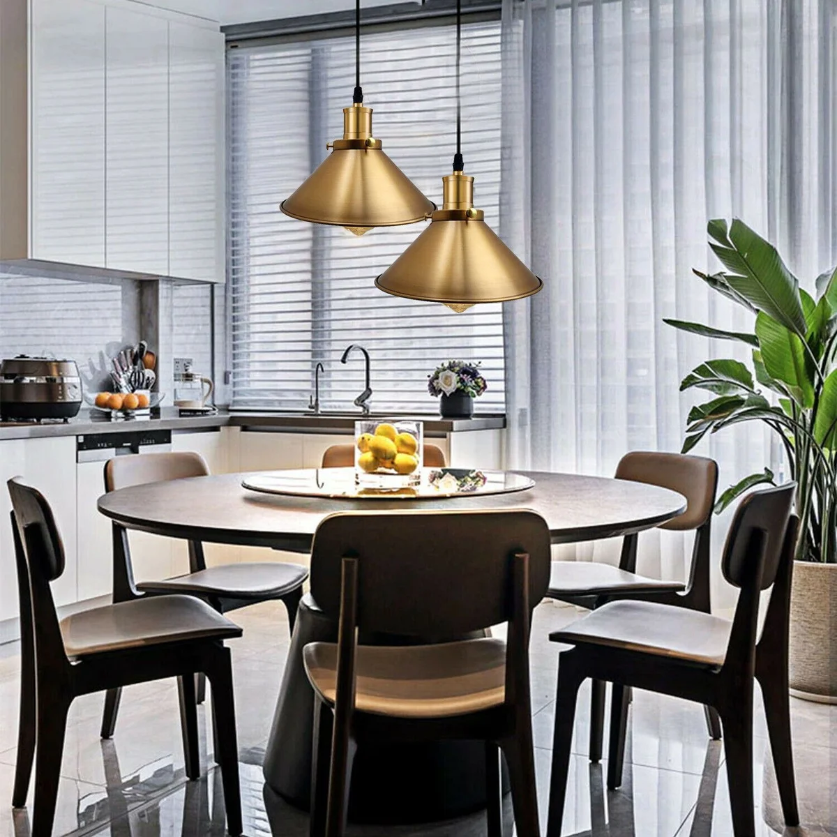 Yellow brass pendant light with a simple dome, hanging from a metal cage, ideal for modern kitchen or living area.