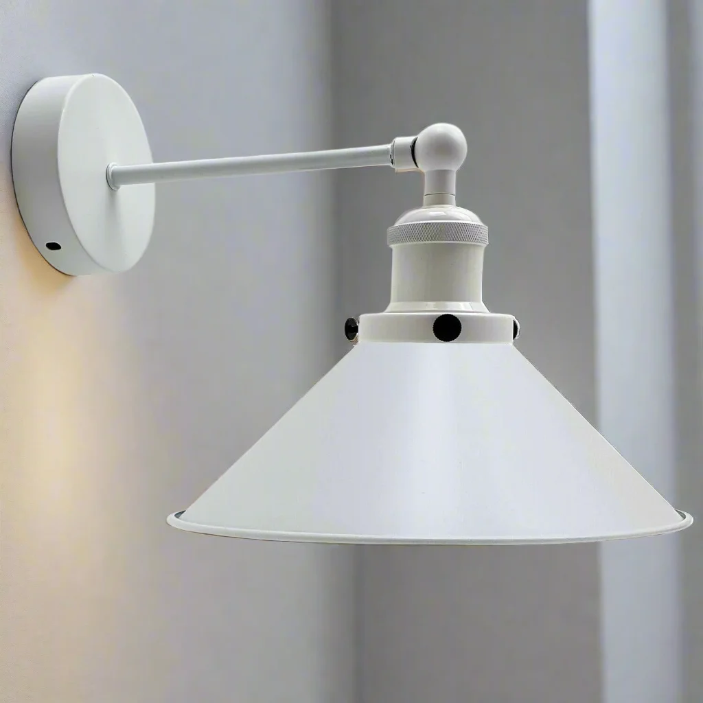 White wall sconce with iron frame and simple lamp shade hanging from a wall, showcasing a modern industrial look.