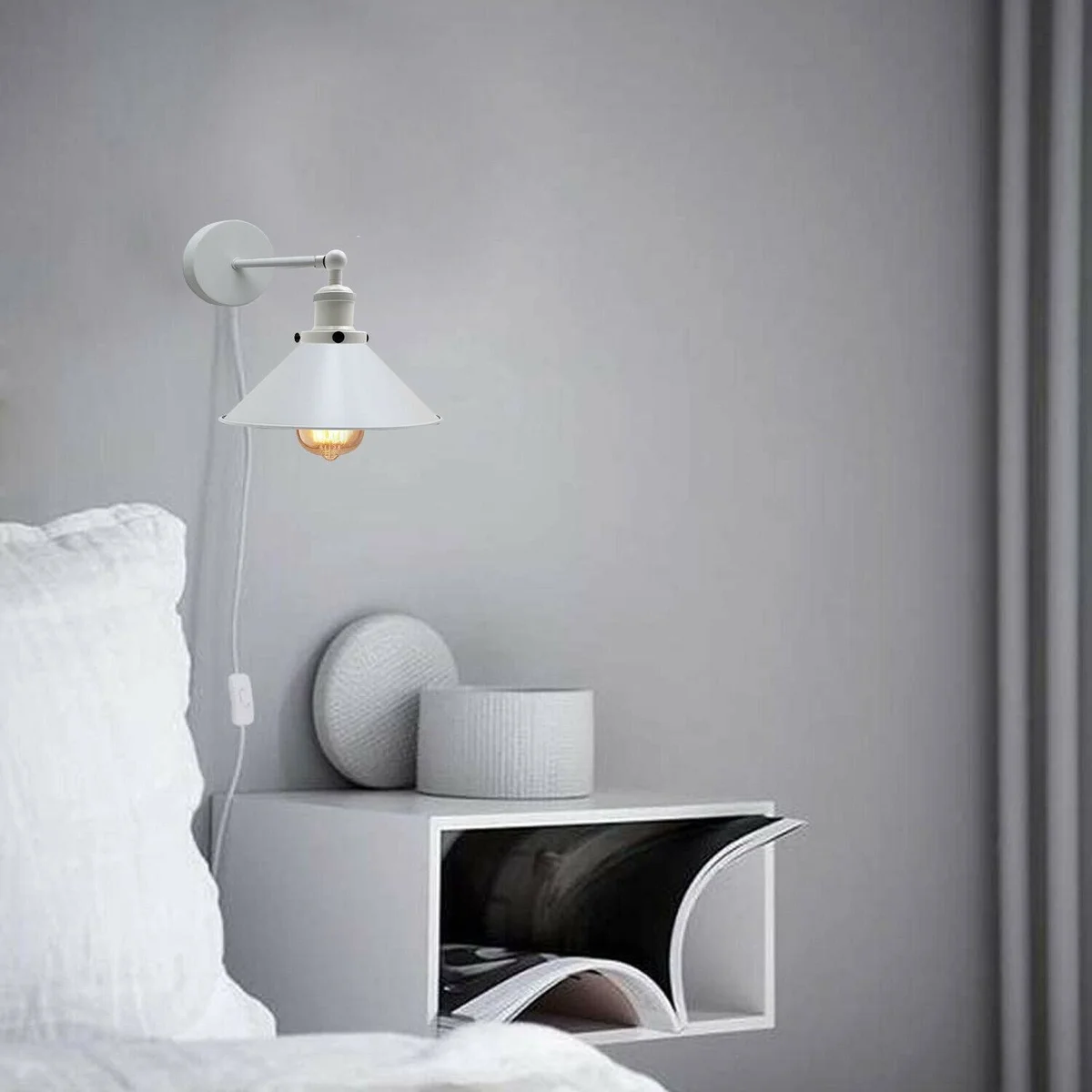 Modern white plug in wall sconce with iron body and Nordic-inspired lamp shade, ready to attach to wall.