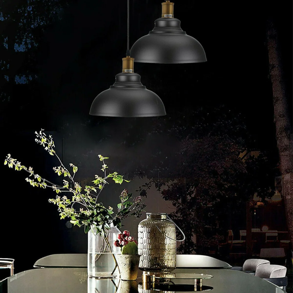 Industrial metal pendant light with brushed copper dome shade hanging from ceiling.