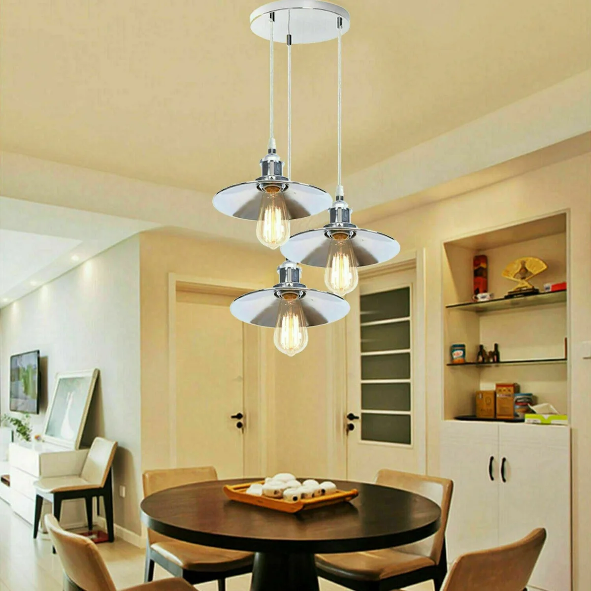 Modern pendant ceiling light featuring three flat polished chrome shades suspended from a rounded base.