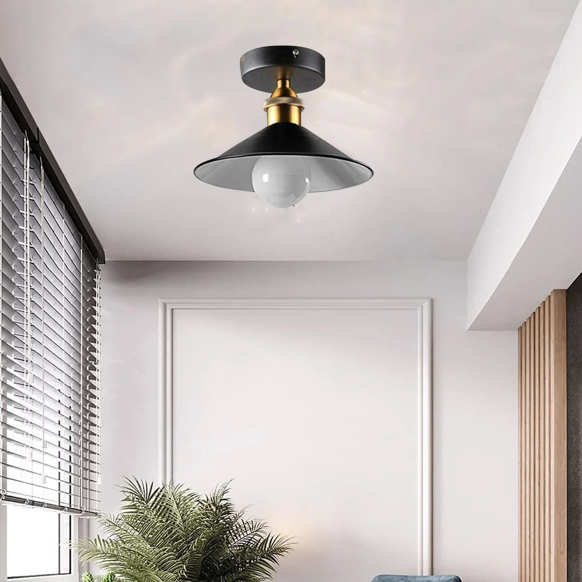Round cone ceiling light in sleek black metal, with E27 base and slim 10cm wide circular plate hanging above.
