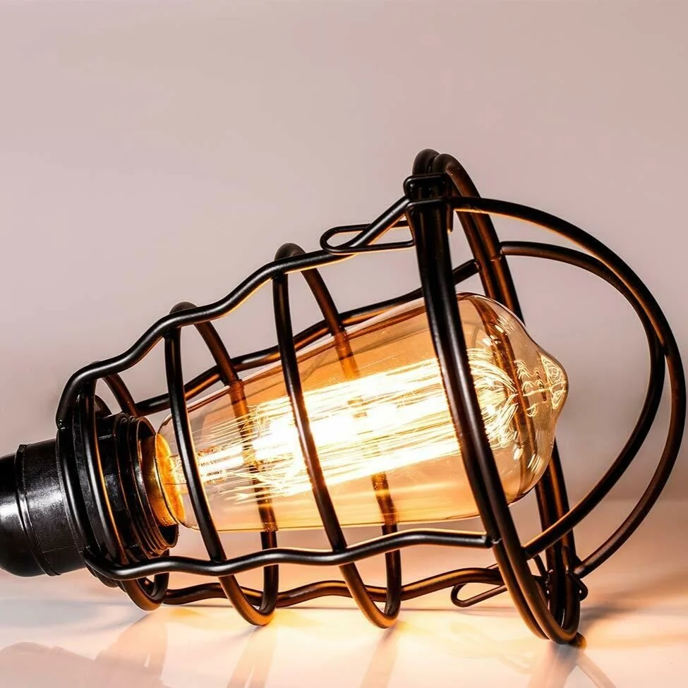 Black cage pendant light with matte black wire cage, single E27 bulb, adjustable 95 cm cord, mounted on a ceiling rose