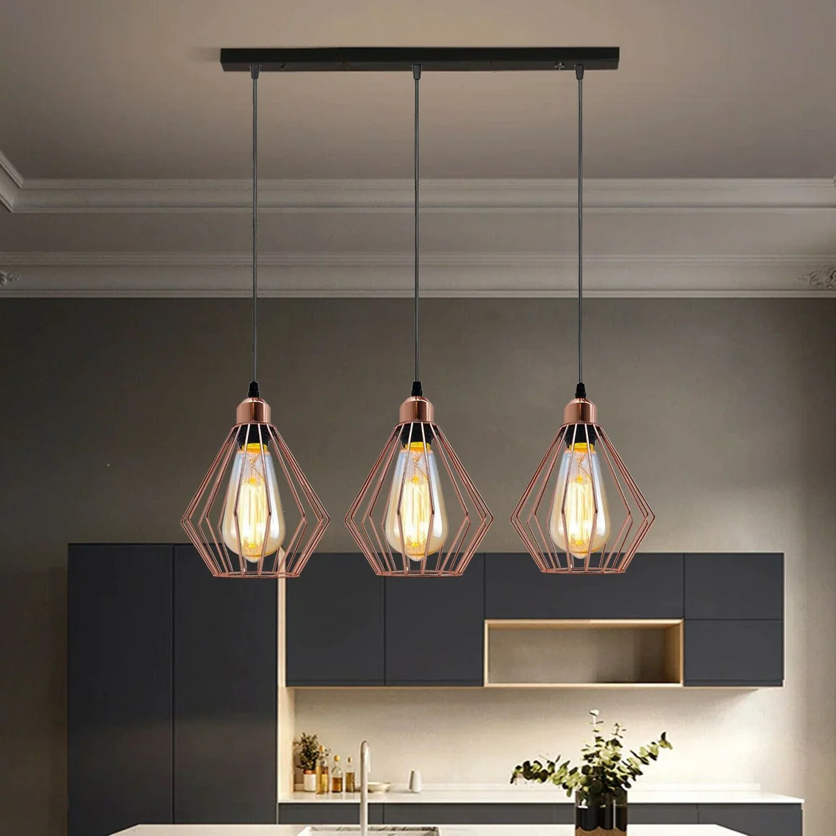 Modern ceiling pendant light in rose gold with metal base and three light holders, hanging on 95cm PVC cable