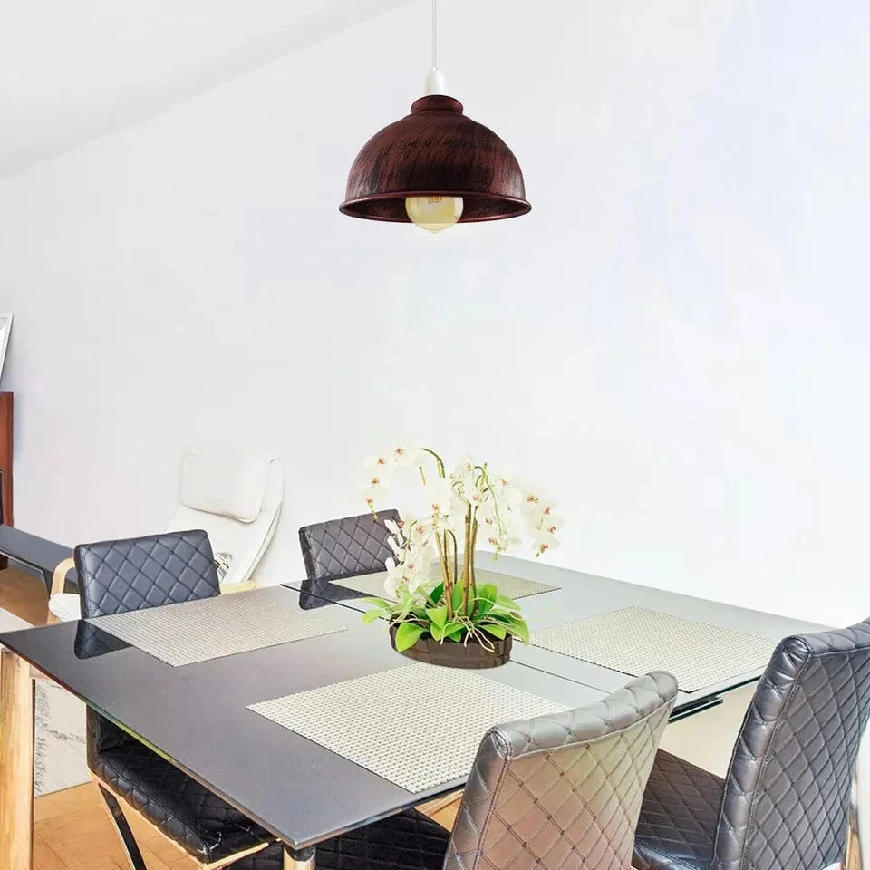 Industrial pendant lampshade in brushed brass with curvy vintage metal shade, 21cm wide, hanging on a ceiling holder.