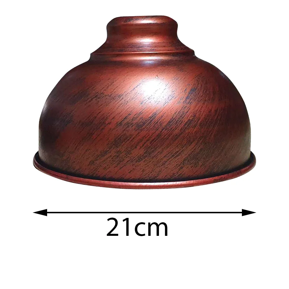 Vintage style light shade with curvy 21cm wide metal construction, resting on a ceiling pendant.