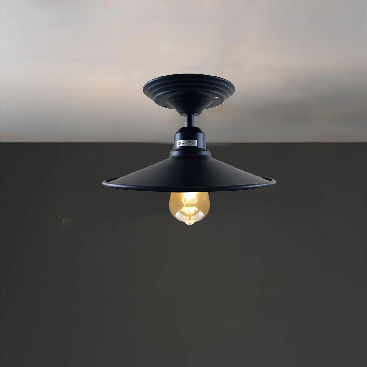 Ceiling mounted lamp with black metal base, gold accents, 14 cm shade and 4 cm hole for E27 bulb, suitable for home décor.