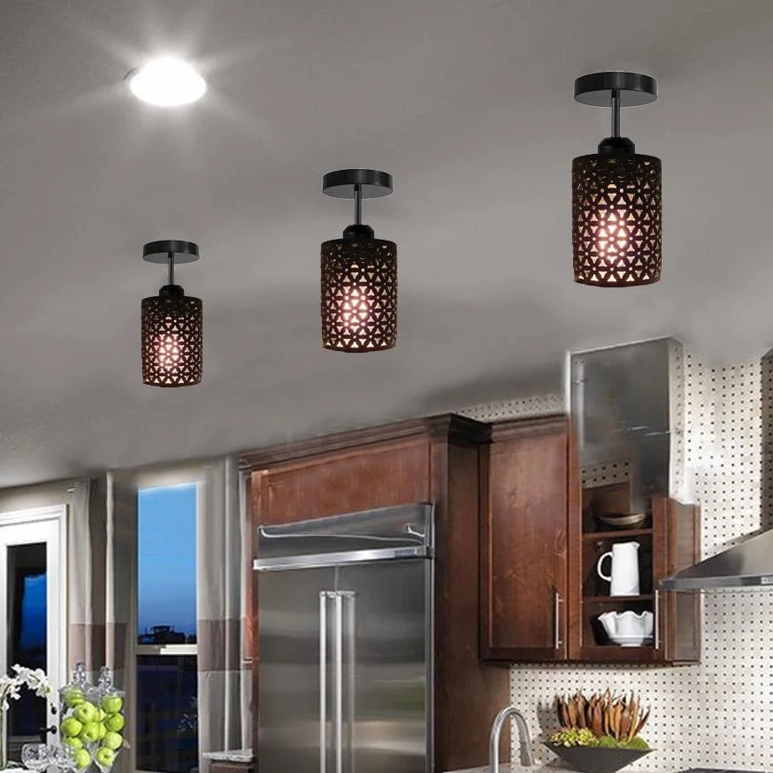 Metal flush mount lamp with cage design in black, featuring a brushed metal base and housing, ready for an E27 bulb.