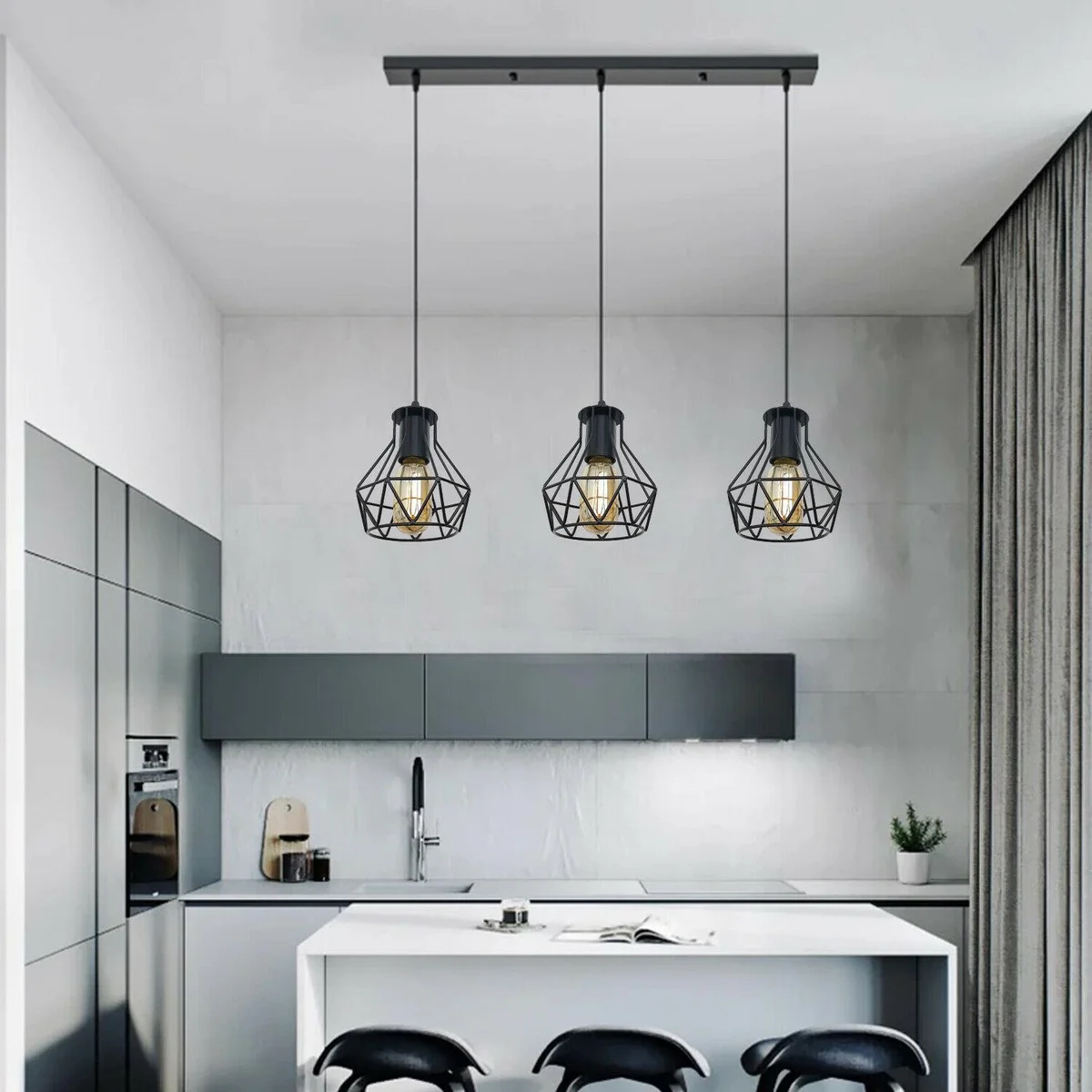 3 head pendant light with black metal cage and PVC cable, mounted on a flat rectangular base.