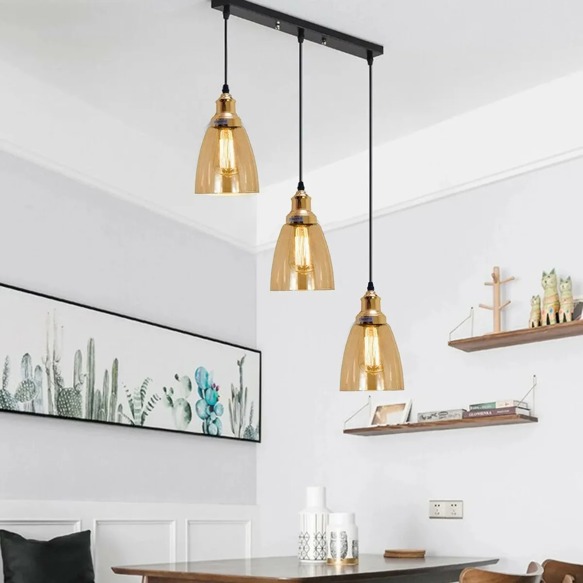 industrial pendant light featuring three amber glass shades with metal base and adjustable cables