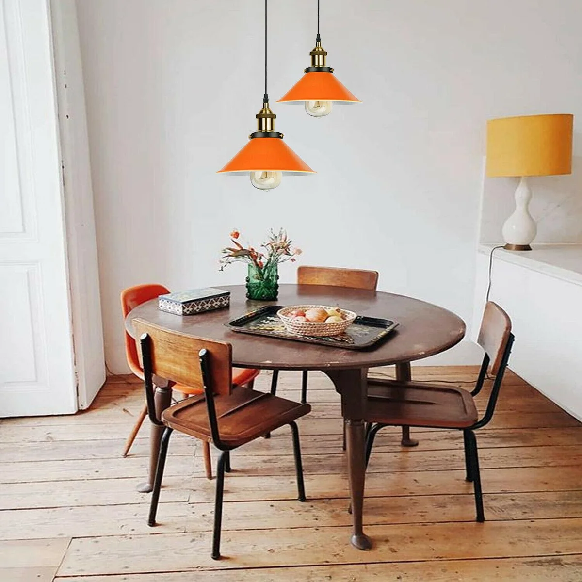 Pendant orange lamp shade hanging from black iron frame, vintage style ceiling light for modern lofts